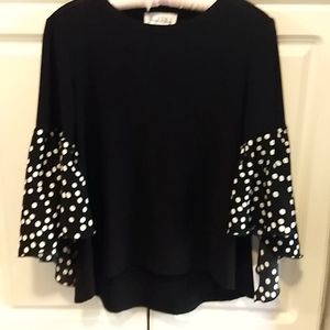 Ladies Black top with flared sleeves. Worn Once. Excellent condition